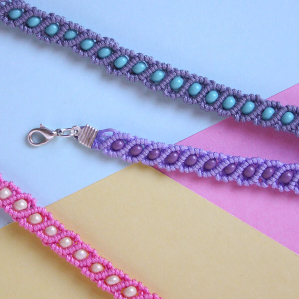 beaded macrame bracelet kit image, showing the finished bracelets in lilac and purple, grey and turquoise and cream and pink on a pastel background