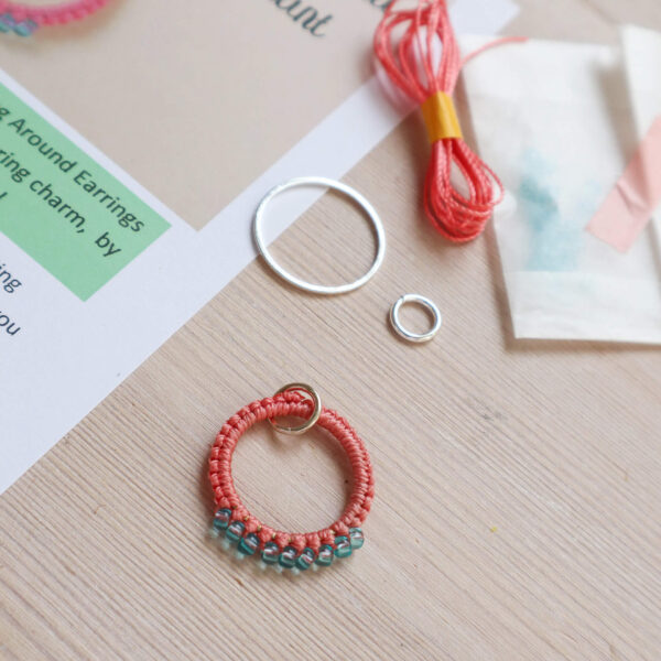 colourful macrame earring kit image showing the bonus mini kit contents and finished pendant in a coral and turquoise blue
