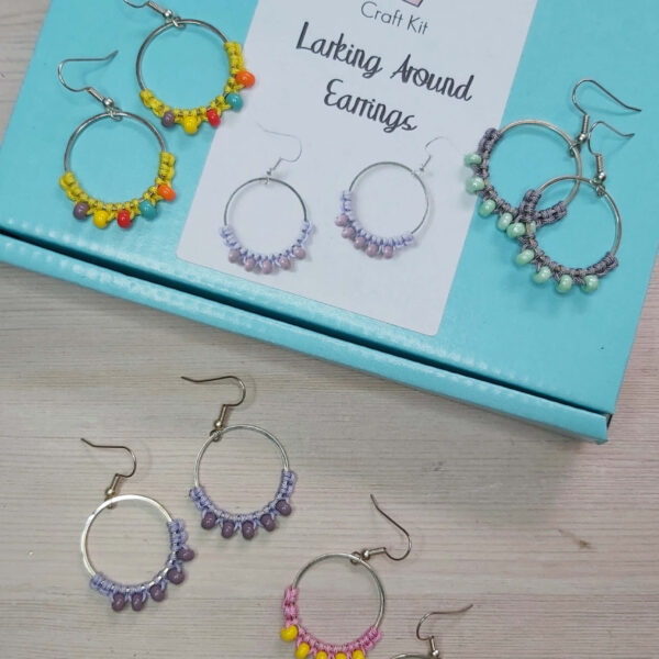 colourful macrame earring kit image showing the aqua blue box with the four colours of finished earrings