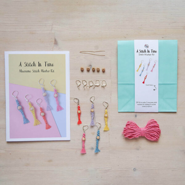 Colourful macrame stitch marker kit, showing the packaging, instruction book, materials and finished stitch markers