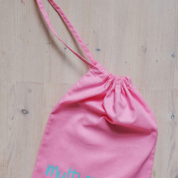 Colourful cotton project bag, pink with teal print of the word multicraftual.