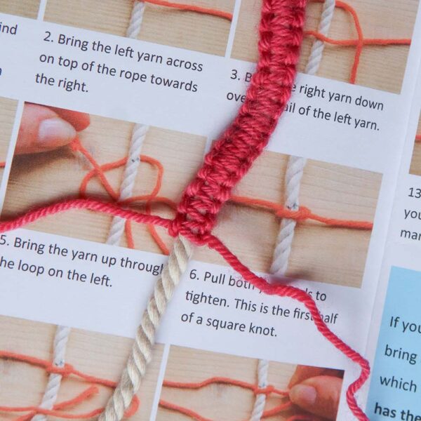 one of the macrame knots in progress on top of the open instruction booklet