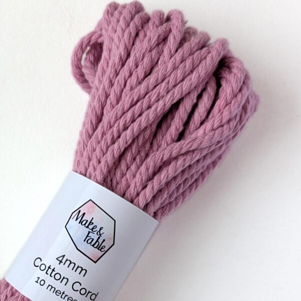 Close up of a bundle of 4mm macrame cord in a rose pink