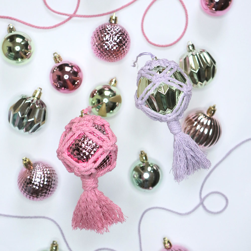 two macrame baubles in pink and lilac
