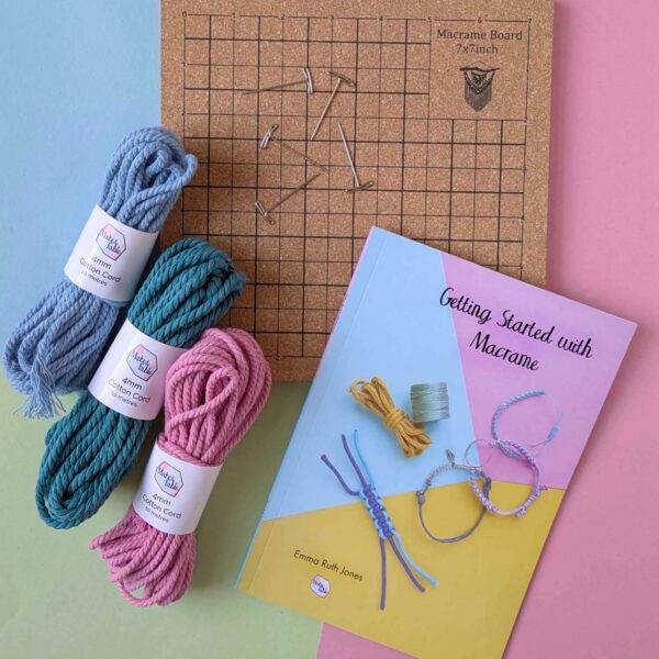 Macrame starter kit with 3 bundles of colourful cotton 4mm macrame cord, a cork board with t-pin and a getting started with macrame book