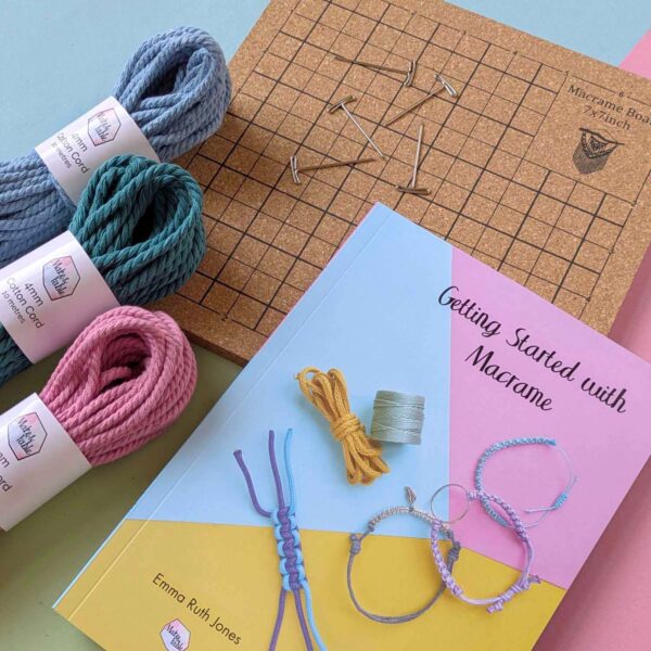 Macrame starter kit with 3 bundles of colourful cotton 4mm macrame cord, a cork board with t-pin and a getting started with macrame book