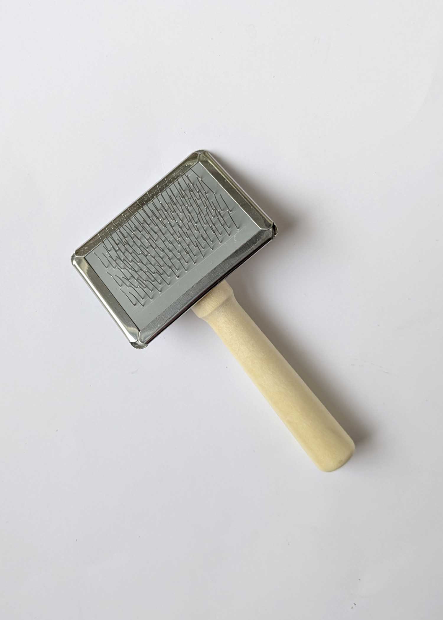 a small macrame brush