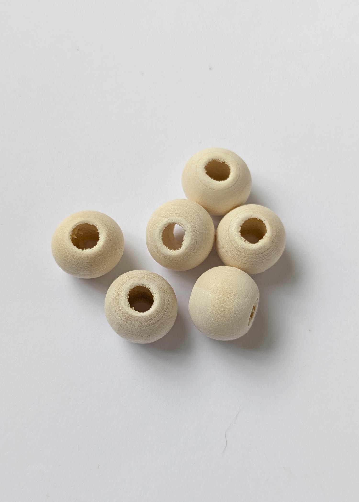 12mm wooden beads, with a natural finish and a large hole for threading into macrame cord
