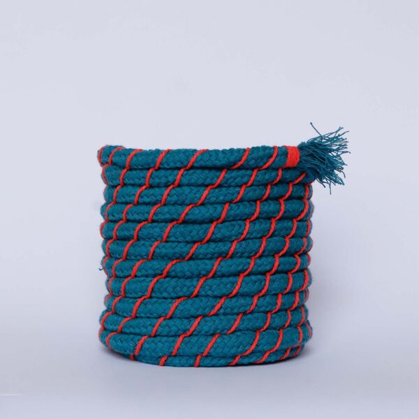 A finished coiled rope basket kit in teal & coral